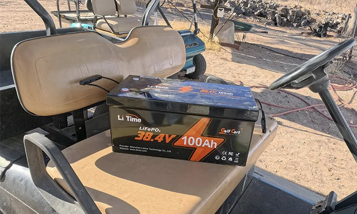 A 36V 100Ah lithium battery is on display in a golf cart.