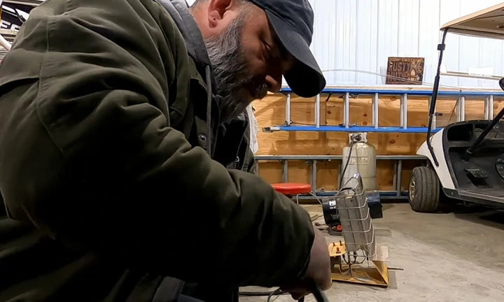 A man is installing a 48v 100ah Bluetooth lithium battery for the golf cart.