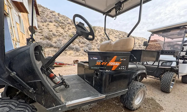 A 36V 100Ah lithium battery is on display in a golf cart.