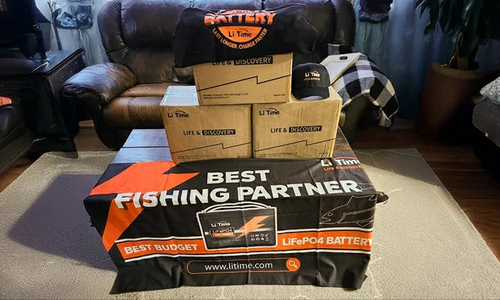 An enthusiastic customer displays their LiTime haul: multiple batteries, a t-shirt, a hat, and a banner