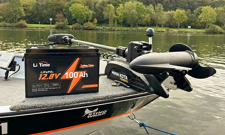 Close-up of a LiTime 100ah battery powering a trolling motor on a modern bass boat