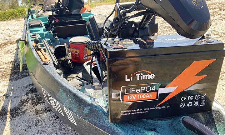 A clean and efficient LiTime 100ah battery installation powering a trolling motor in a canoe