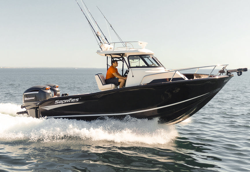 A cabin boat cruising on the water, representing powered by reliable trollling motor battery system