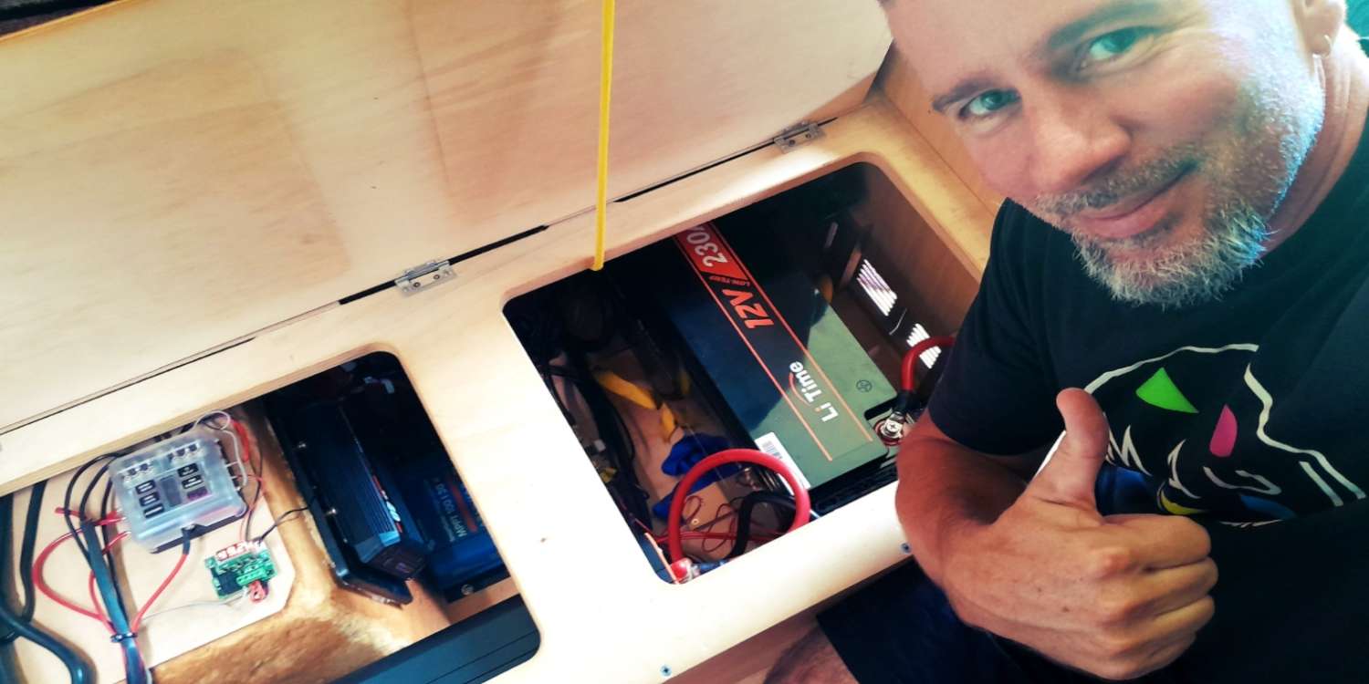 Josh  gives a thumbs-up next to his newly installed LiTime 12V 230Ah battery