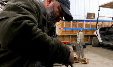 A man is installing a 48v 100ah Bluetooth lithium battery for the golf cart.