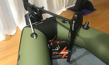 A LiTime 100Ah mini battery paired with a Minn Kota trolling motor in an inflatable boat