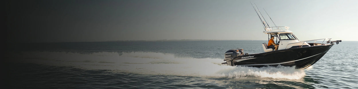 A cabin boat cruising on the water, representing powered by reliable trollling motor battery system